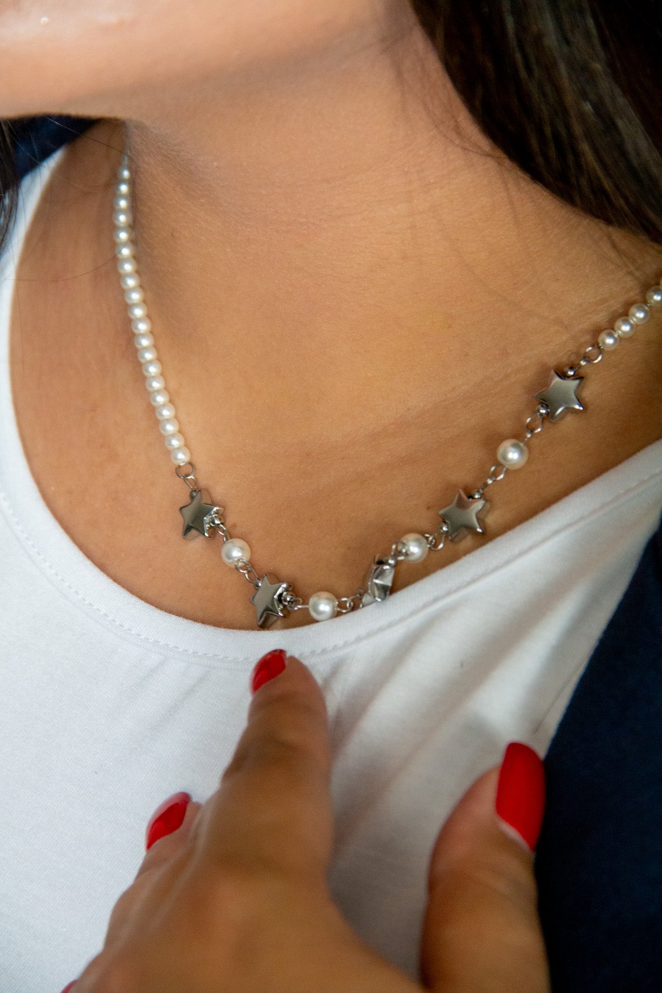 Collana di perle con pendenti a stella